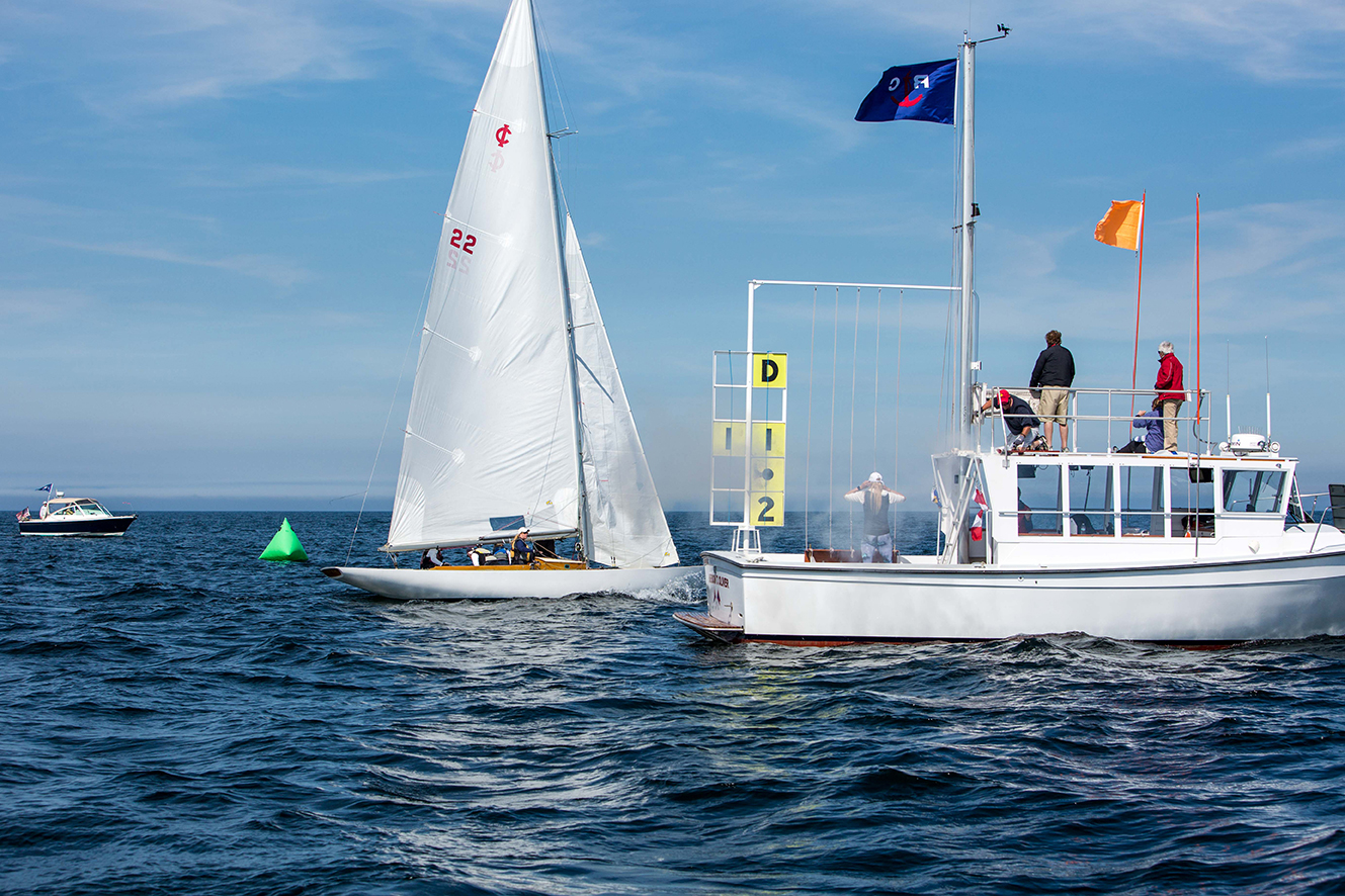 Team Nor’wood of Fishers Island takes the first-place gun at the finish of Race 3.