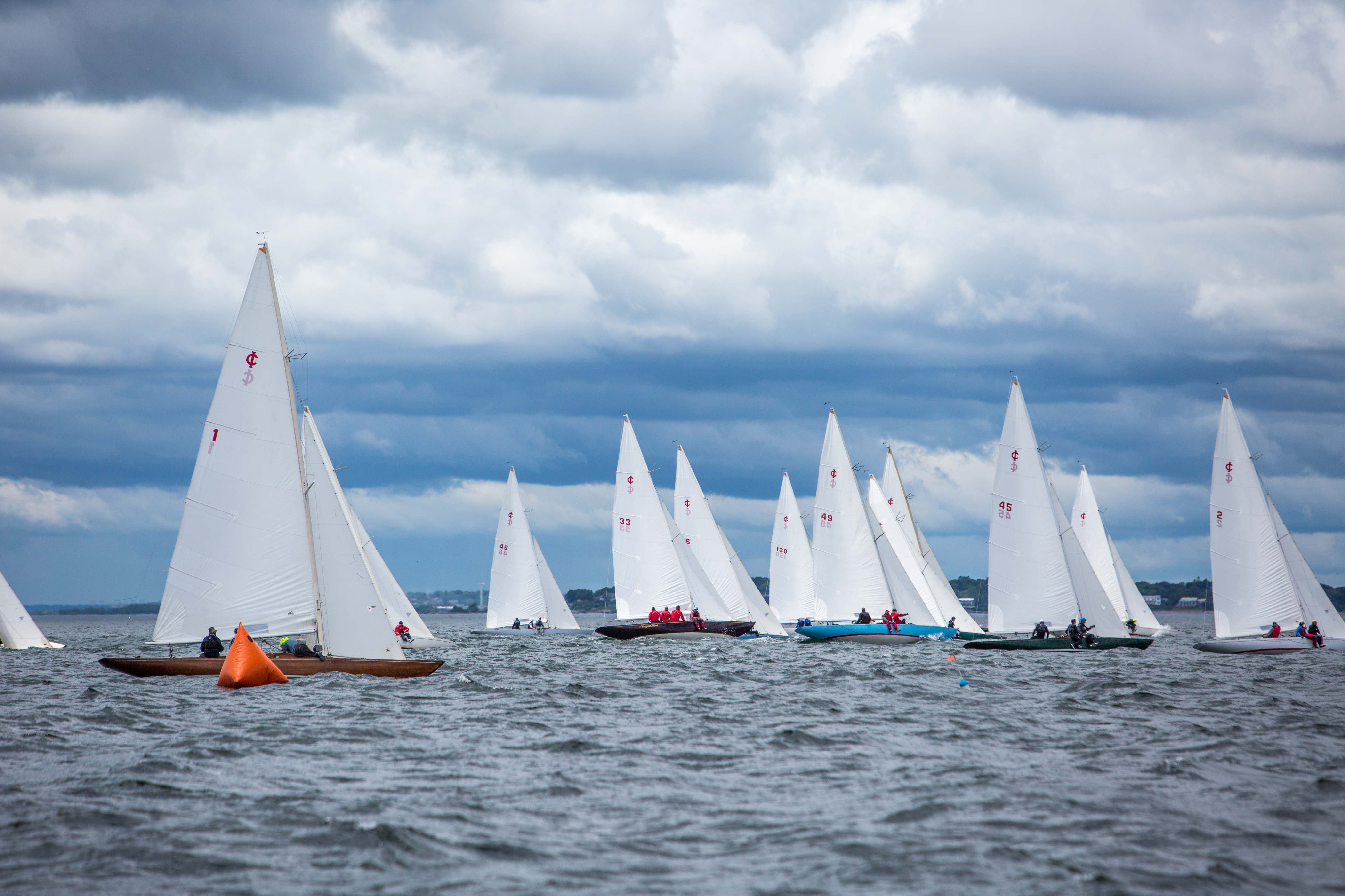 The sixth and final championship race gets underway under dramatic skies off Marblehead, Mass. All photos by Nicholas Schoeder.